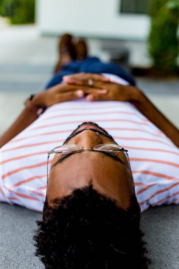 Man lying on his back thinking